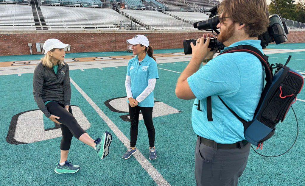 CCU Kinesiology lecturer appearing in television live shot at Brooks Stadium