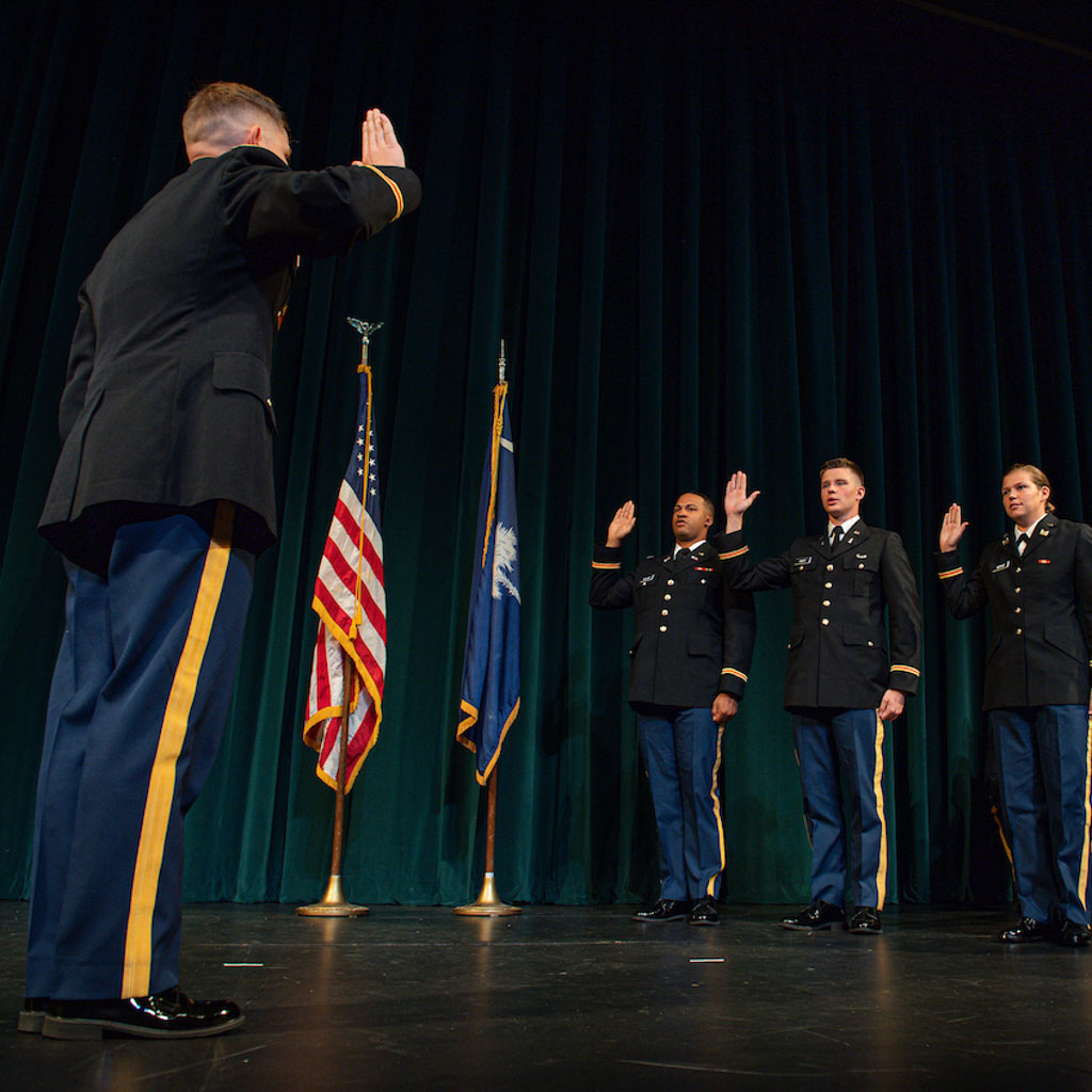 A CCU Army ROTC Chanticleer Company cadet commissioning on stage